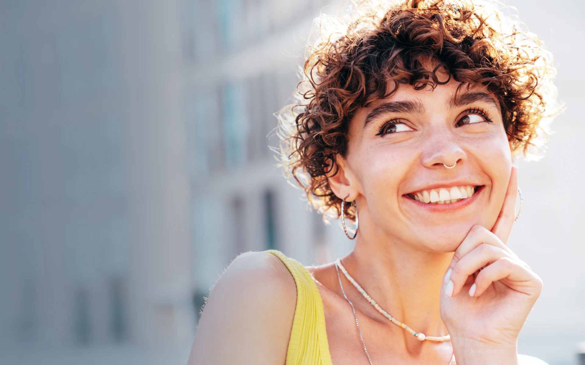 Woman smiling brightly after dental treatment at Lilburn Smile Makers Dental in Lilburn, Georgia